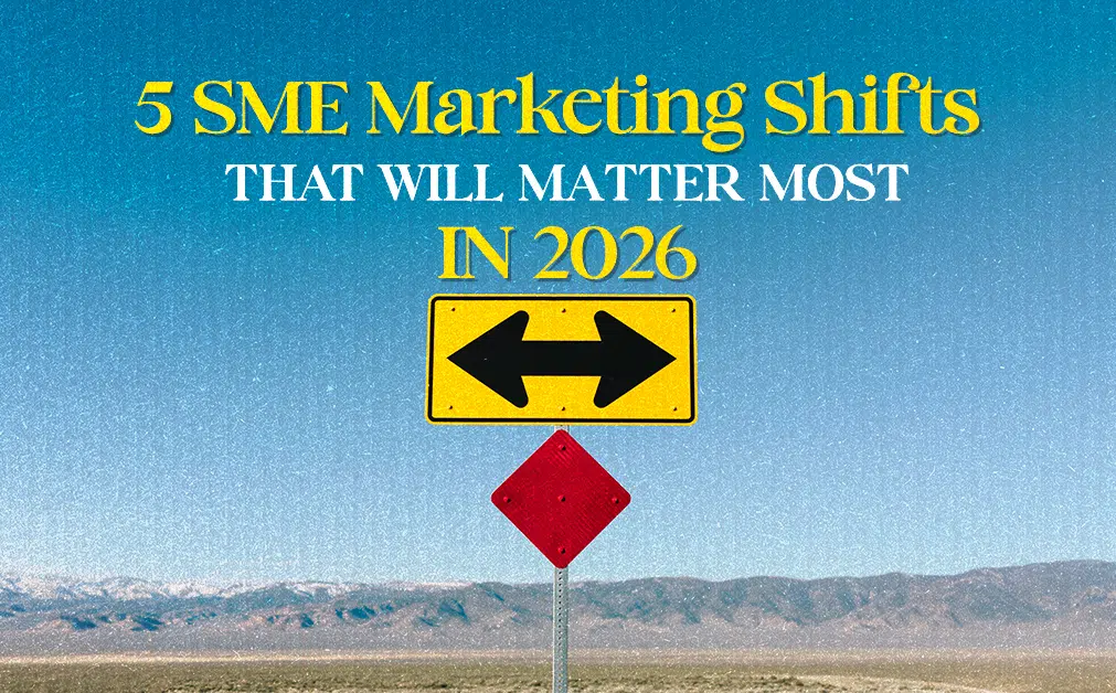 A road sign in a desert landscape with a blue sky shows two black arrows pointing in opposite directions on a yellow background, symbolising decision-making. Above it, bold text reads: "5 SME Marketing Shifts That Will Matter Most in 2026" in yellow and white serif font.